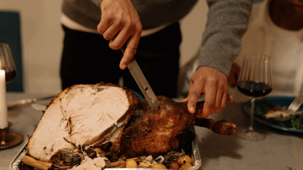 man carving a turkey
